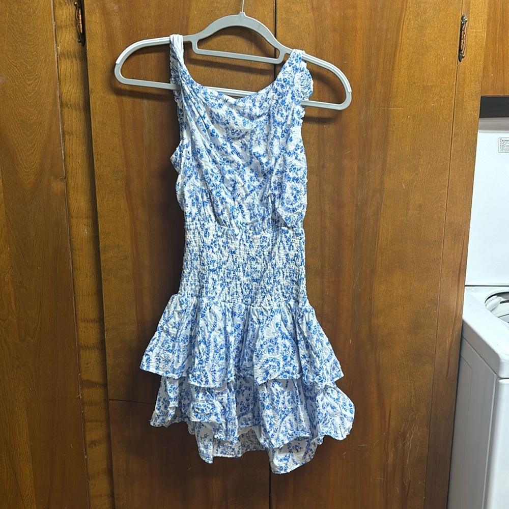 The cutest white and blue open back romper!  
Bought at a boutique!